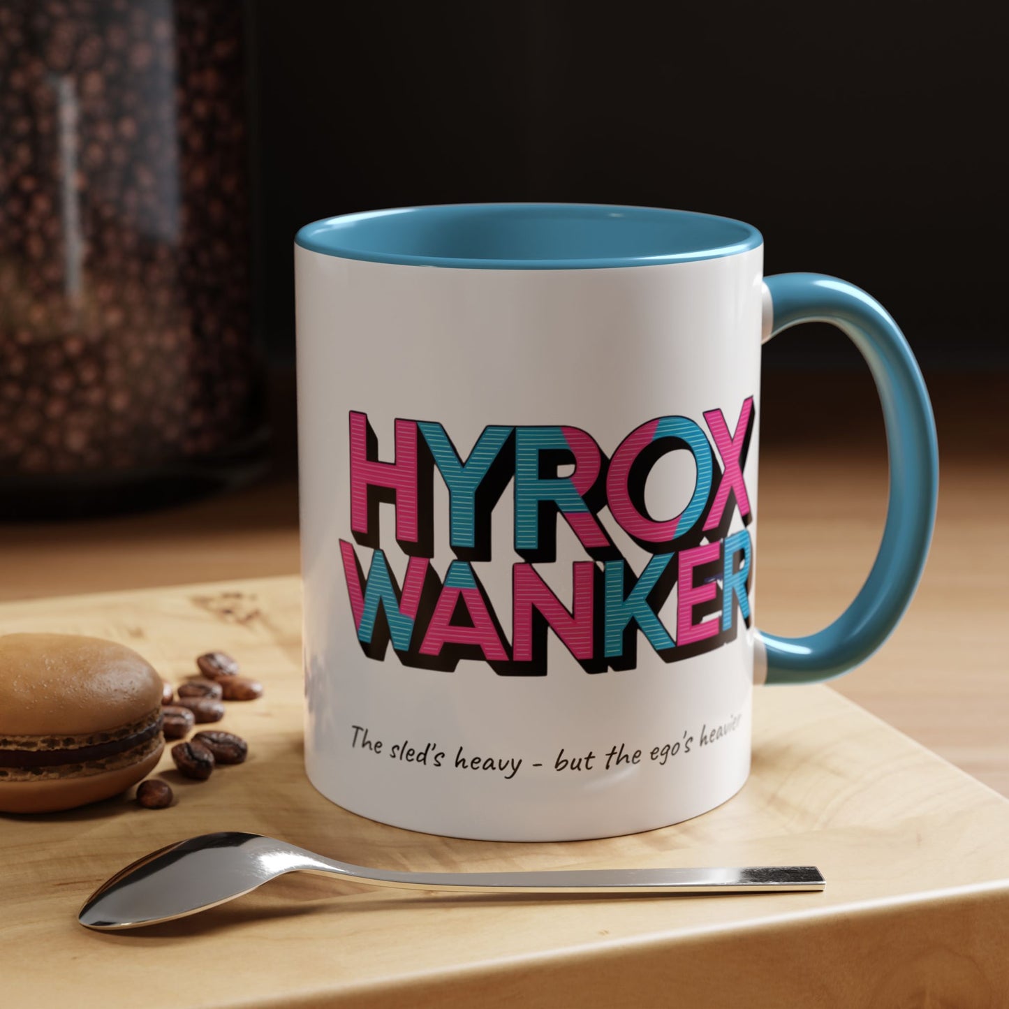 "White ceramic mug with humorous HYROX training text about heavy sleds and egos"