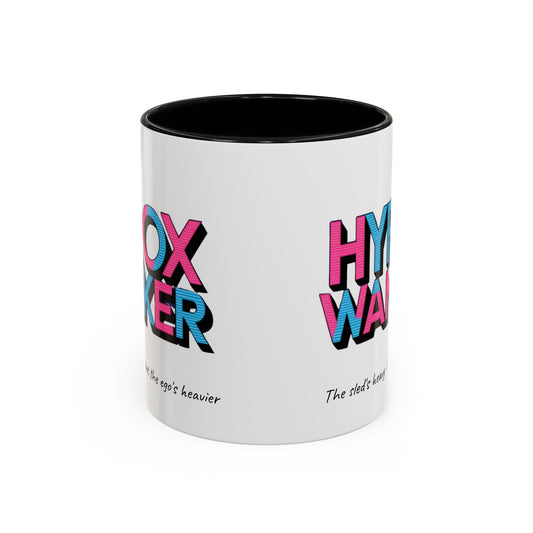 "White ceramic mug with humorous HYROX training text about heavy sleds and egos"